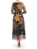 Elegancka czarna sukienka rozkloszowana maxi w jesienne liście – kobiecy krój wysmuklający sylwetkę 37086