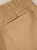 Beżowe spodnie damskie z ozdobnymi zameczkami 35354
