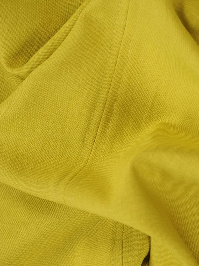 Elegancka sukienka wizytowa o prostym kroju w kolorze limonki – modelujące sylwetkę przeszycia 35744